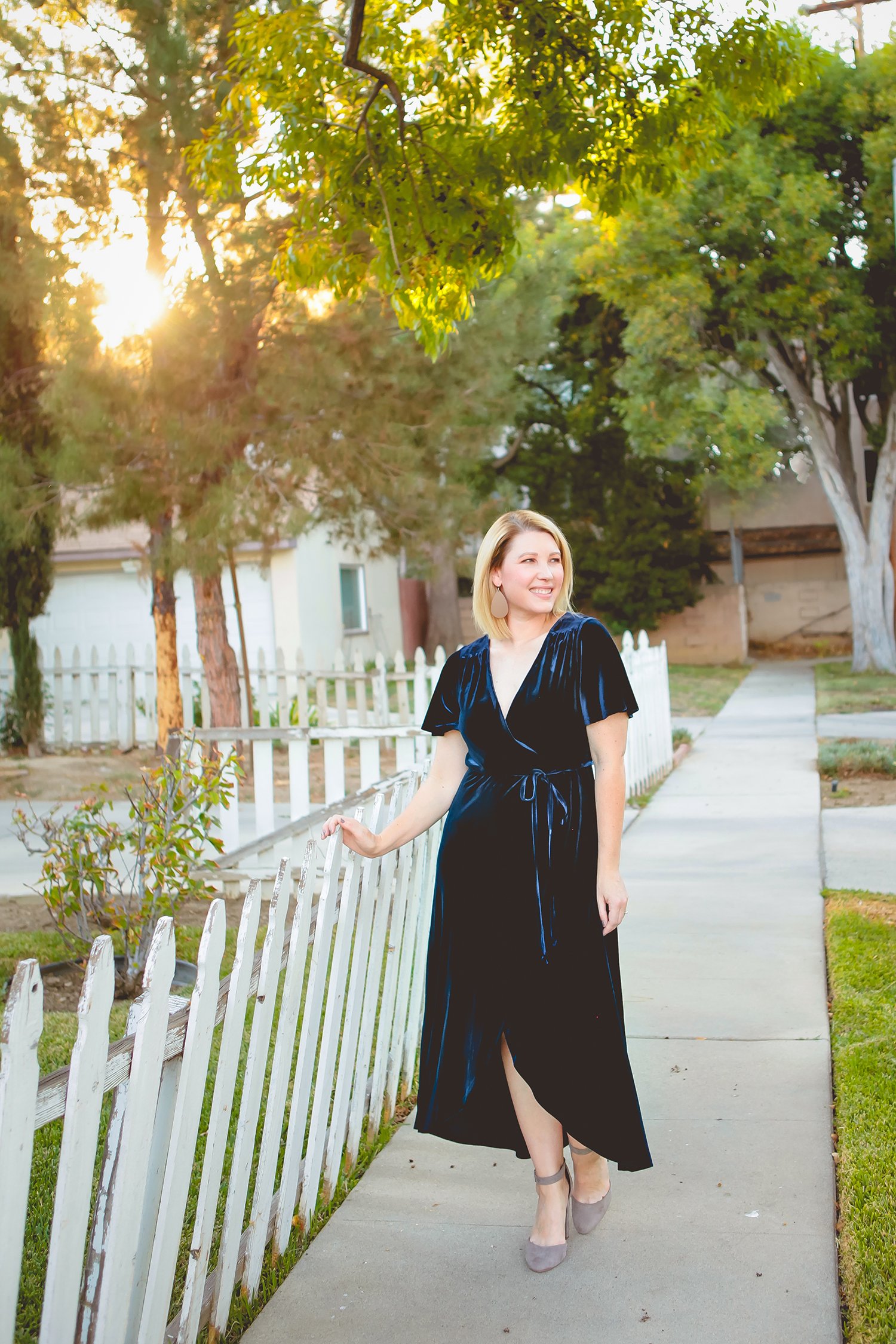 On the hunt for holiday dresses? This velvet wrap dress is the perfect piece to wear over and over again this holiday season!