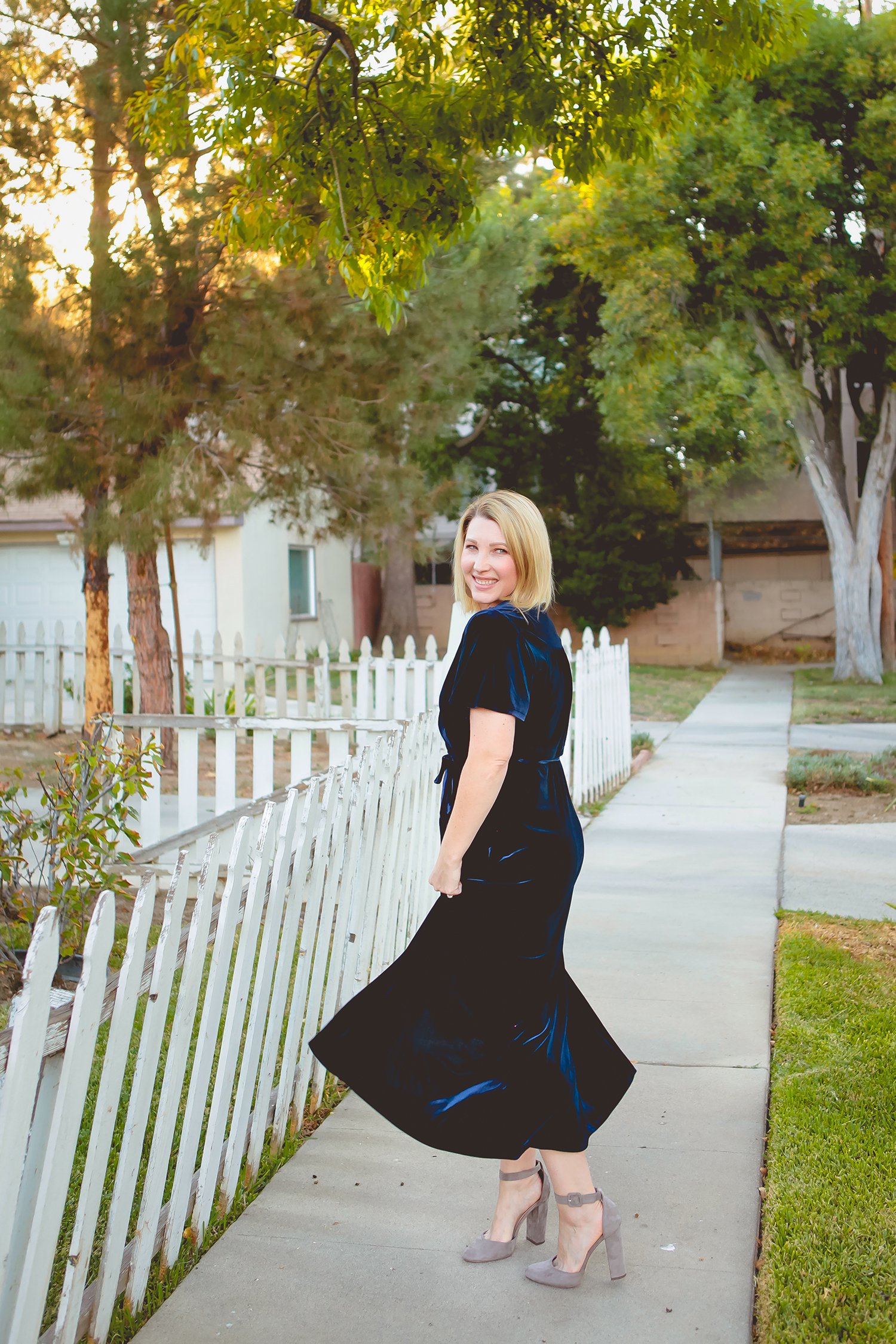 On the hunt for holiday dresses? This velvet wrap dress is the perfect piece to wear over and over again this holiday season!