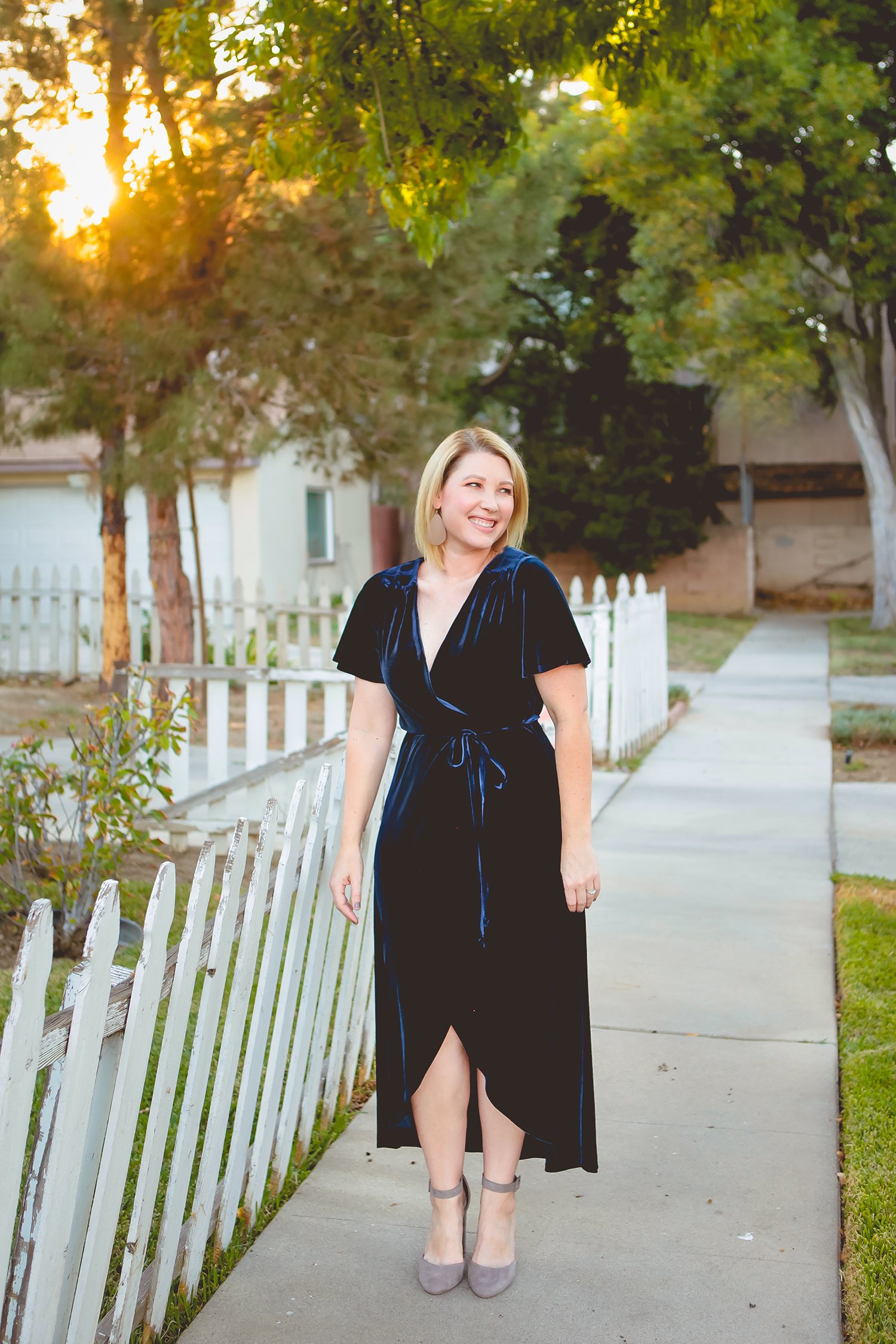 On the hunt for holiday dresses? This velvet wrap dress is the perfect piece to wear over and over again this holiday season!