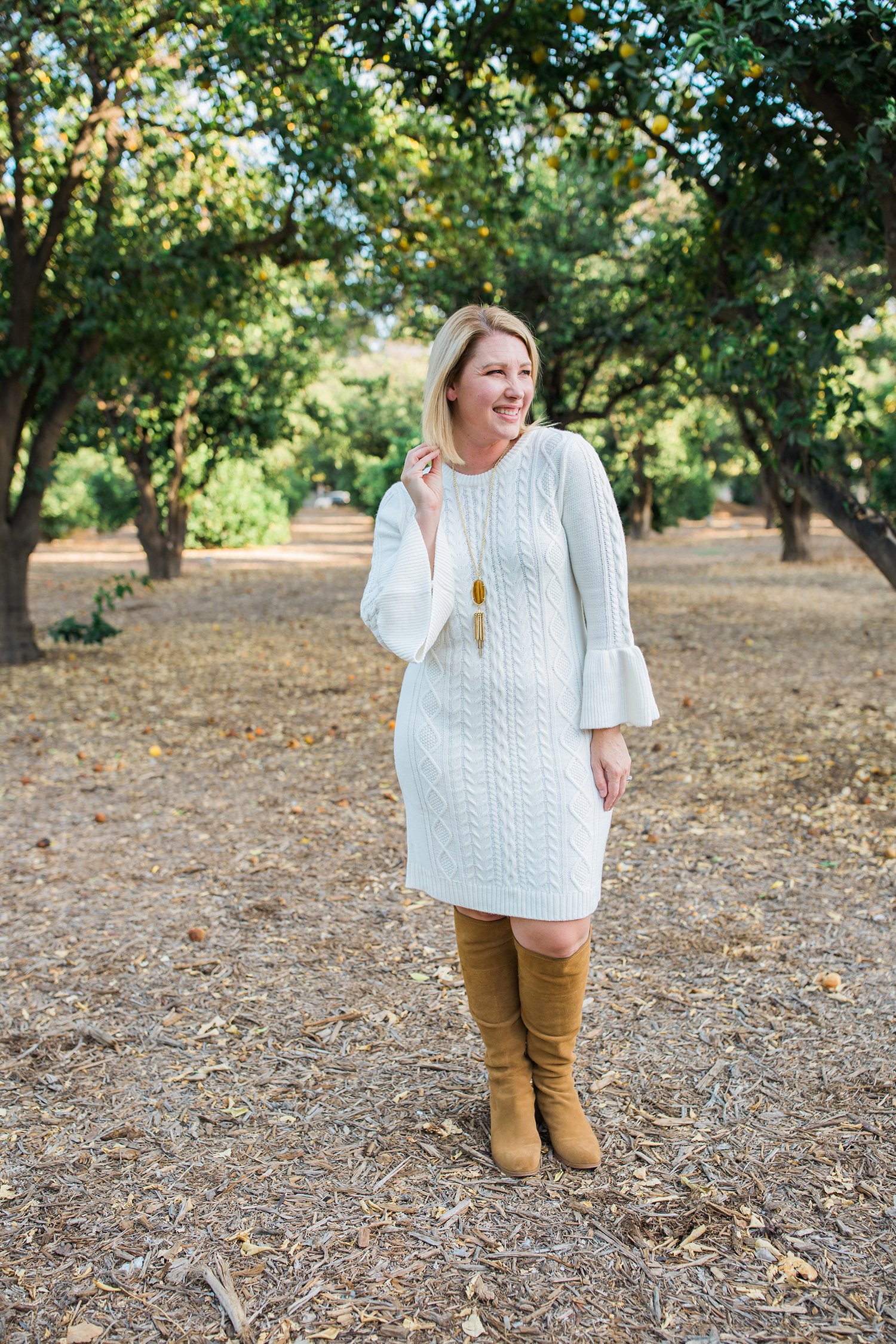 On the hunt for holiday dresses? This white sweater dress is flattering, comfortable and super versatile!