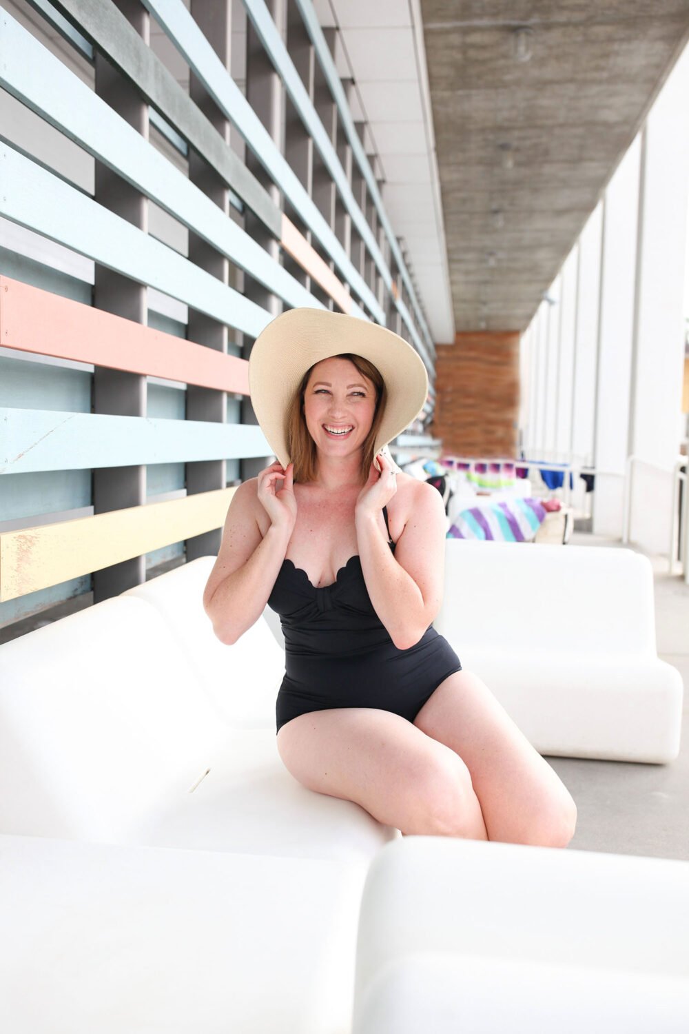 On the hunt for a great black bathing suit? This scalloped swim suit is SUPER flattering on a pear shape body!