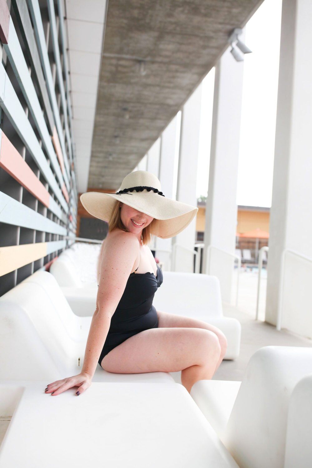 Looking for the best scalloped swim suit for a pear shape body? This black one piece bathing suit is super flattering and a great price!