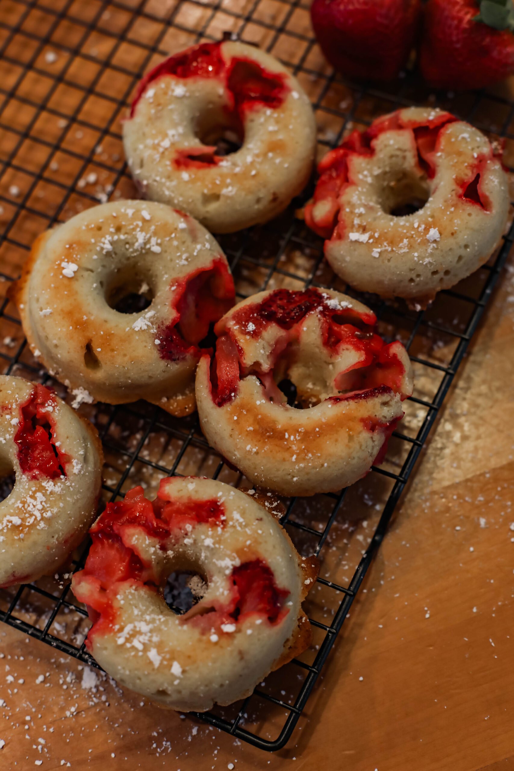 Looking for an easy brunch recipe to make with your kids? These baked strawberry donuts are delish, and a great use for fresh strawberries!